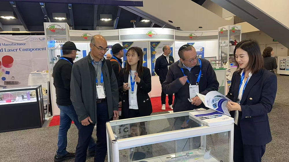 GIAI photonics staff introduces products to visitors